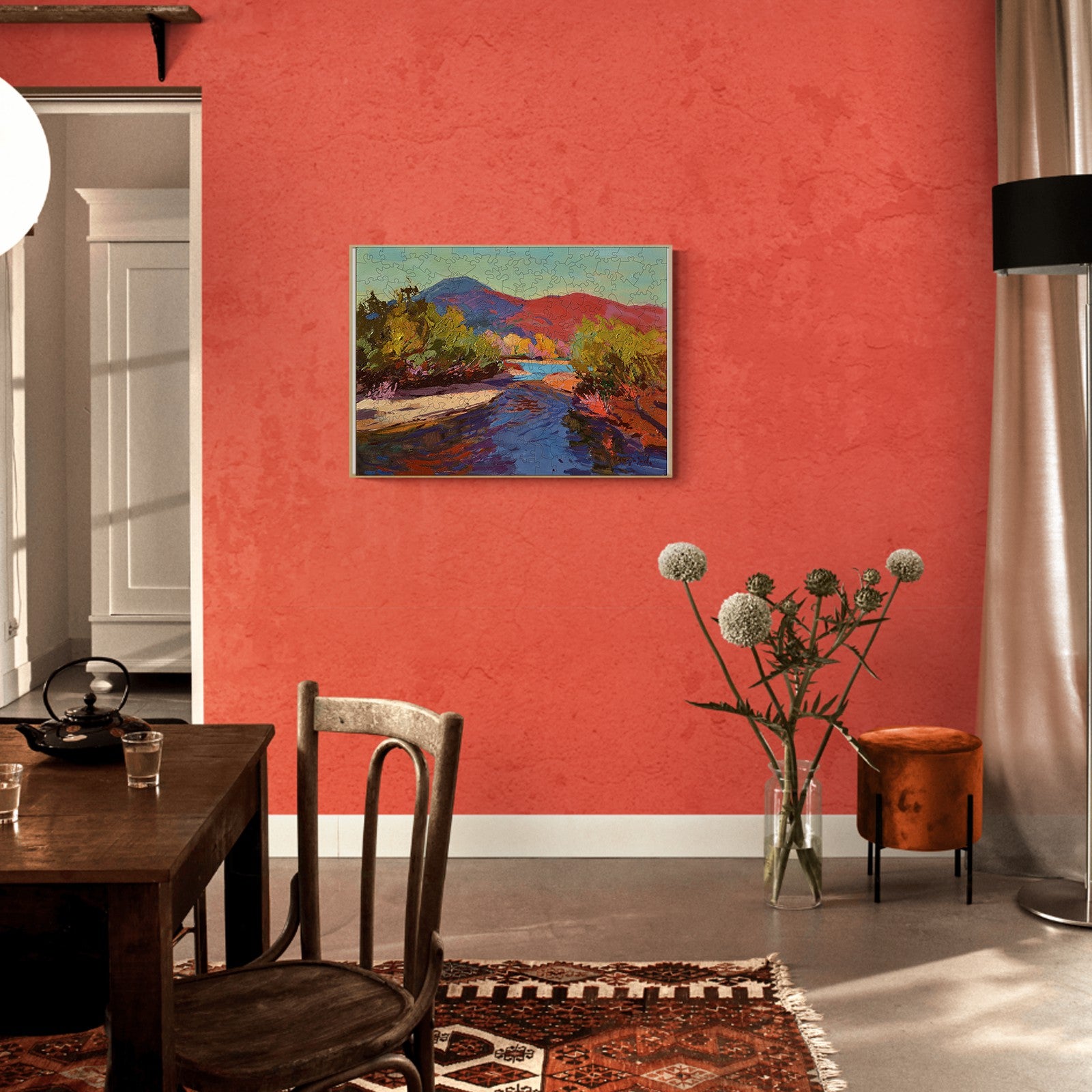 Evening artwork by Alexander Shandor displayed in a stylish living space with coral walls.