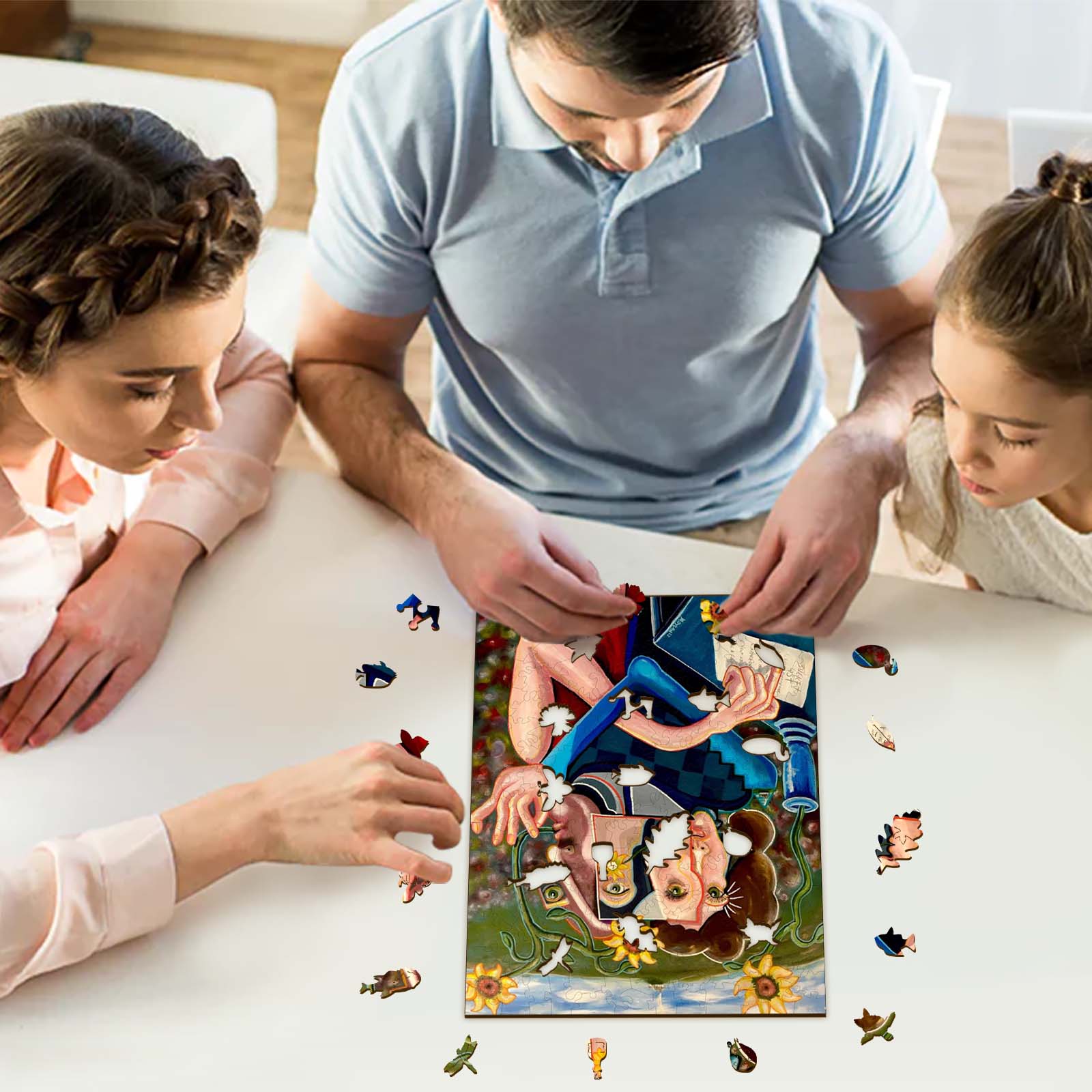 Family engaged in a puzzle featuring art by Dylan Gill, showcasing creativity and togetherness in an artistic setting.