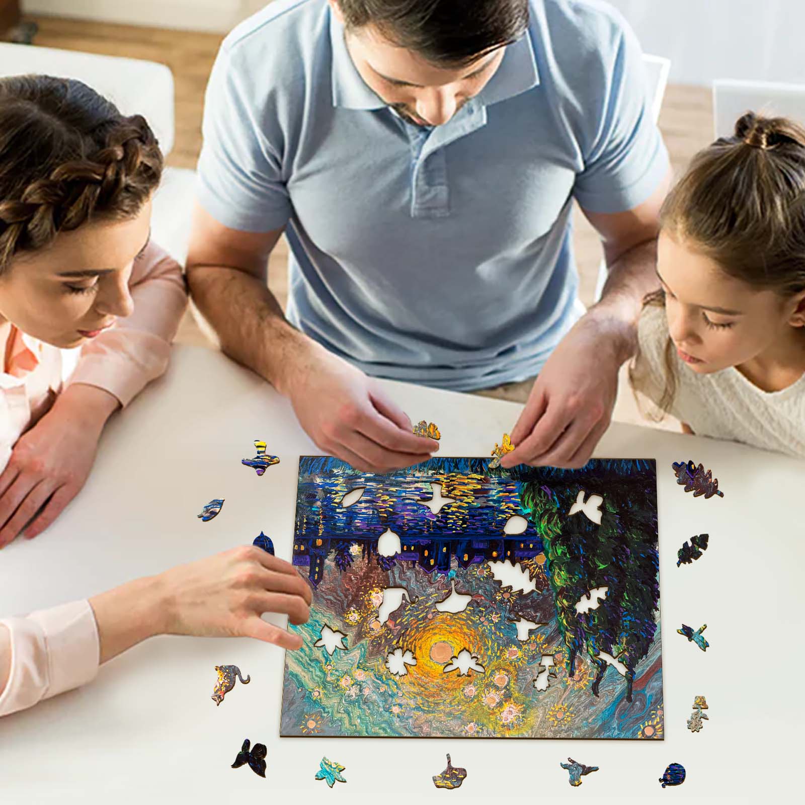 Family enjoying a puzzle of Starry Night by Nicholas John VARDAXIS, surrounded by colorful puzzle pieces.