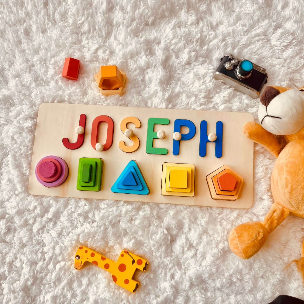 Personalized wooden stacking toy spelling 'JOSEPH' with colorful shapes, ideal for enhancing children's learning and play.
