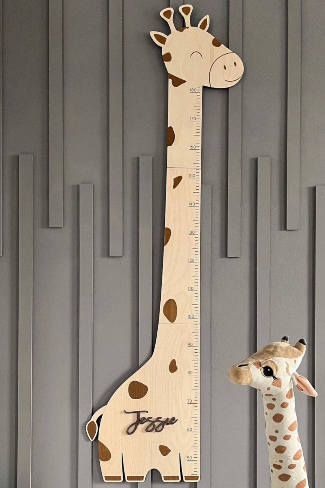 Personalized wooden giraffe growth chart height ruler for kids' room decor featuring playful design and customizable name.