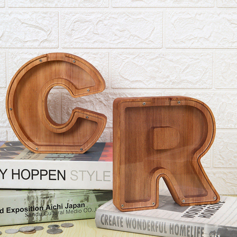 Custom wooden letter piggy bank in C and R shape, perfect for teaching kids about savings and financial awareness.